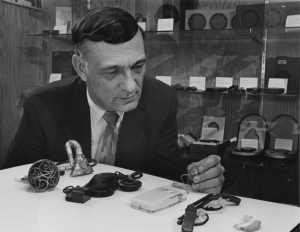 Kenneth W. Berger with hearing aid collection, 1968